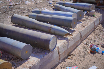 Unexploded Ordnance and Artillery Shells on the Ground. Conflict in the Middle East, military environments.