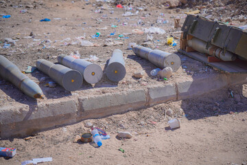 Unexploded Ordnance and Artillery Shells on the Ground. Conflict in the Middle East, military environments.