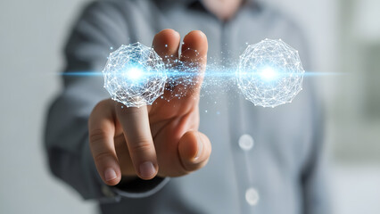 A man in a gray shirt interacting with glowing digital orbs