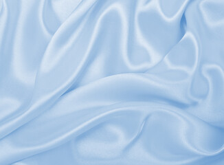 Obraz premium Smooth elegant blue silk or satin luxury cloth texture as abstract background. Luxurious background design