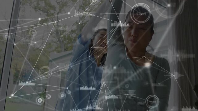 Therapist guiding patient in medical therapy room, displaying holographic network nodes, bar charts