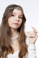 Portrait of a beautiful young girl wearing pearl jewelry