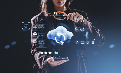 Woman interacting with digital cloud storage interface using mag