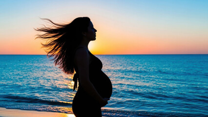 Fototapeta premium Pregnant woman caressing her belly as she stands silhouetted against a vibrant turquoise water backdrop at sunset, hair flowing gently in the breeze