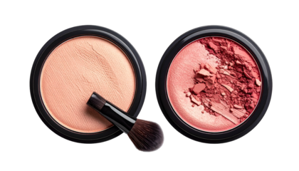 Overhead shot of two makeup compacts, one with a brush, against a black background