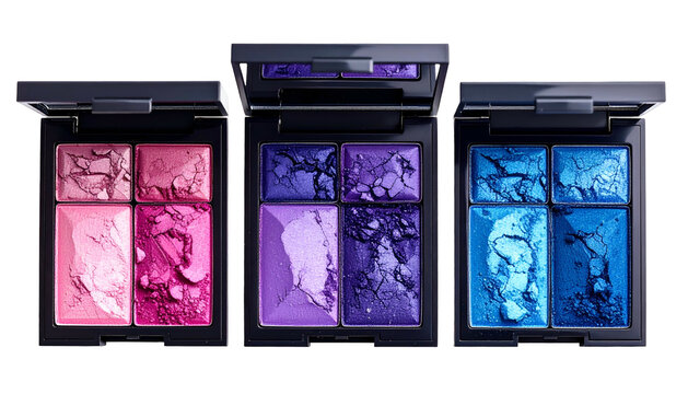 Three open compacts of eyeshadow with varied colors, from pinks to blues