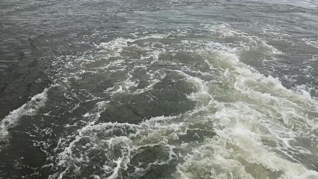 Strong current of water in a river, lake, or sea. Natural body of water. Flow of water.

