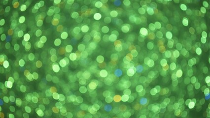 Obraz premium Green blurry light bokeh background. Abstract natural or festive lights. Decoration for holiday, St Patrick or event.