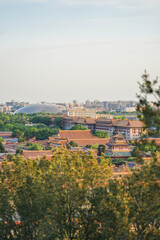 Obraz premium The Forbidden City,Aerial view of traditional Chinese architecture with red rooftops and surrounding urban landscape