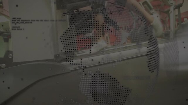 Industrial document processing machine showing globe and code overlay while hands placing paper