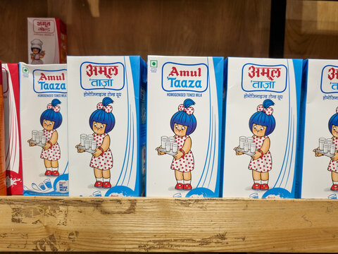 tetra packs of amul milk stacked on shelf showing india largest co operative milk producer and the products they have