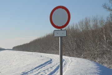 No entry sign in a winter, snowy environment