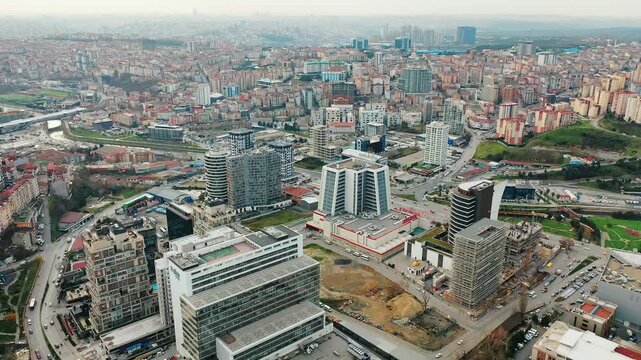 Istanbul Kagithane aerial view featuring modern office plazas and business centers. Cinematic drone flight over the urban valley.