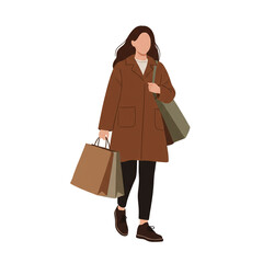 Young woman walking with shopping bags in casual autumn outfit  
