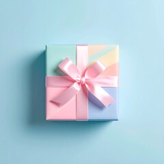 Pastel-wrapped present with pink ribbon on a light blue background