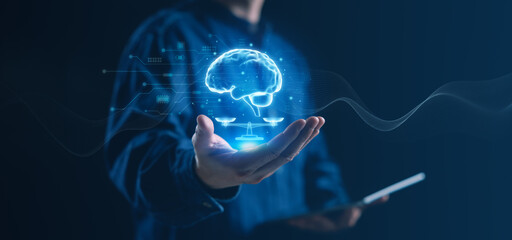 Digital brain hologram floating above a human hand represents mental health, cyber safety, and ethical technology. Concepts of digital wellbeing, data protection, and human-centered innovation.