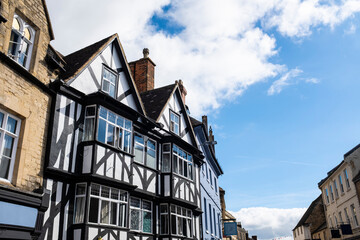 Old traditional wooden houses facade in the beautiful town of Bibury, Cotswolds, England