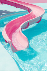 Pink water slide curves against pastel blue background and clear swimming pool water. Vibrant summer holiday background concept.