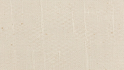 Fototapeta premium Close-up macro shot of a textured beige fabric with a subtle woven pattern and visible threads