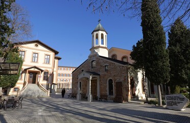 Surp Sarkis Armenian Church in Varna, built 1844, features stone masonry, bell tower, Armenian school, and khachkar memorial honoring 1915 genocide victims, BG, 19 Jan. 2025