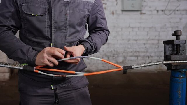 Careful Inspection And Precise Handling Of Cables For Secure Industrial Connections In Workshop