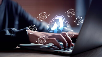 Cloud computing interface with upload and download symbols highlights digital storage solutions, real-time data sync, and smart business technology, operated via laptop for seamless online access.