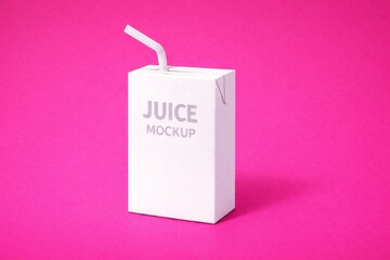 Minimalistic Juice Box with Straw on Vibrant Pink Background