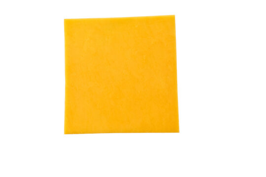 slices of tasty cheddar cheese isolated on a white background, top view.
