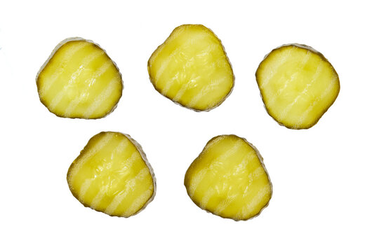 sliced marinated gherkins isolated on a white background. Top view.