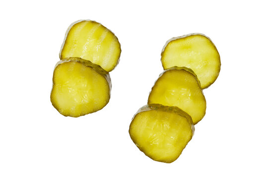 sliced marinated gherkins isolated on a white background. Top view.