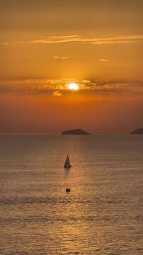 Golden sunset over the sea with sailing boat, view from Buyukada Island