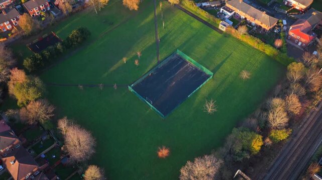 An elevated aerial video capturing the community green space of Marje Kelly Park in Gorse Hill, in Old Trafford - Greater Manchester. 