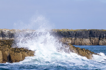 Ocean Waves Crashing Against Coastal Cliffs