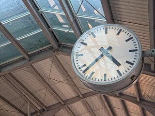 Large Analog Public Station Clock Under Glass Skylight Roof.