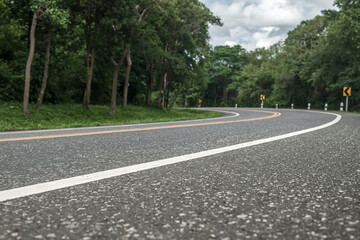 Asphalt road in the forest. Road background.