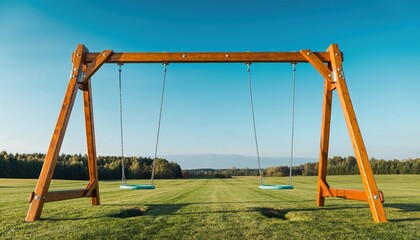 Wooden Swing Set on Green Lawn Under Blue Sky.