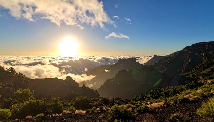 Sunrise Over Mountain Range Above Clouds.