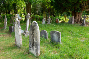 Brockenhurst, UK - May 31st 2025: Gravestones in St Nicholas&rsquo; Churchyard.