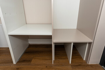 Fototapeta premium A carpenter assembling a wardrobe in a vestibule, a precise handiwork.
