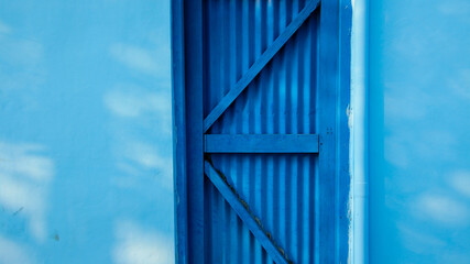 Obraz premium Industrial door with blue color