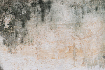 The white cement wall with rain stains.