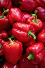 Fresh red bell peppers abundant in market display