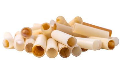 Pile of off-white, cylindrical objects with hollow interiors, slightly browned ends