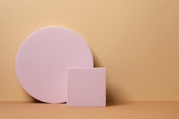 Pink podiums with smooth, textured surface under soft tones. Ideal for product mockups, cosmetic displays, or minimal brand presentations. 3D rendering