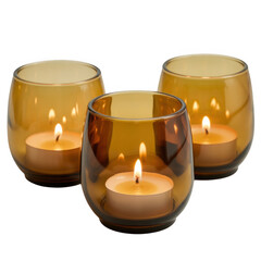 Three lit candles in amber glass holders isolated on a transparent background