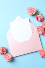 Beautiful composition with pink roses and paper envelope on color background. Ideal for Valentine's Day, 8 March, Birthday or other holidays