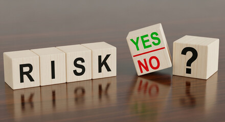 Wooden cubes spelling RISK, with a tilting cube showing YES/NO and a question mark cube, depicting decision-making and uncertainty about risk