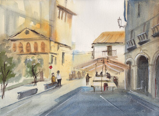 A street cafe in the shade of a house