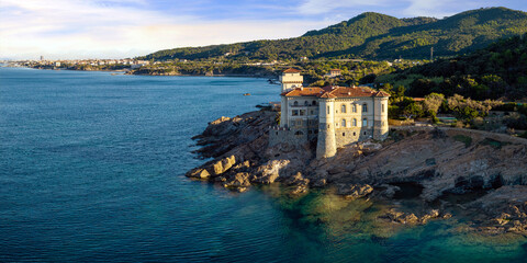 Panoramic Aerial View of Castello del Boccale at Sunrise: Medieval Castle on the Rocky Cliffs of Livorno Coast, Tuscany Italy
