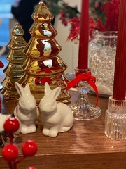 Festive Christmas Decor with Ceramic Trees, Bunny Figurines and Red Candles